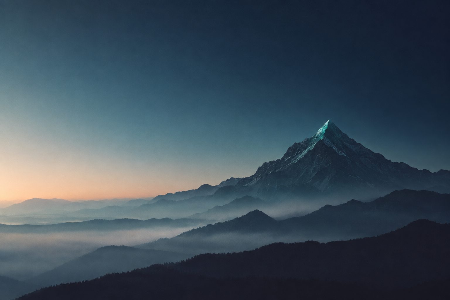 A mountain summit rising above layers of morning mist